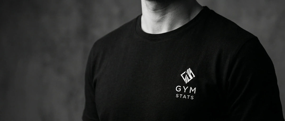 Close-up of black Gym Stats T-shirt with white logo on the chest.